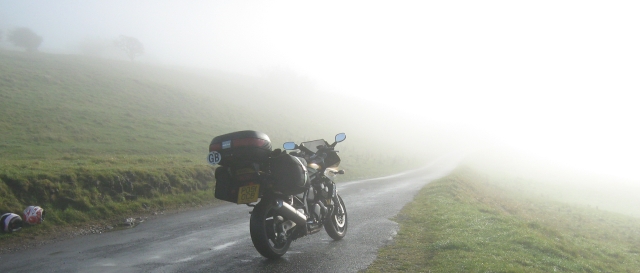 yamaha fazer 600 with luggage in the mist on a hillside